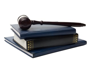 Judge book with wooden hammer