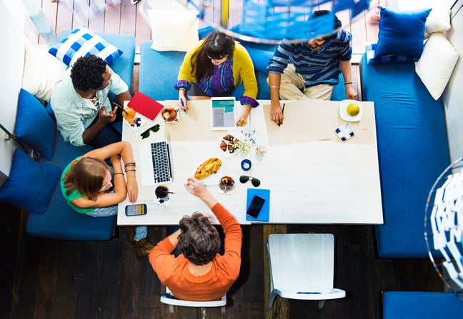 Team having a meeting around a mini office