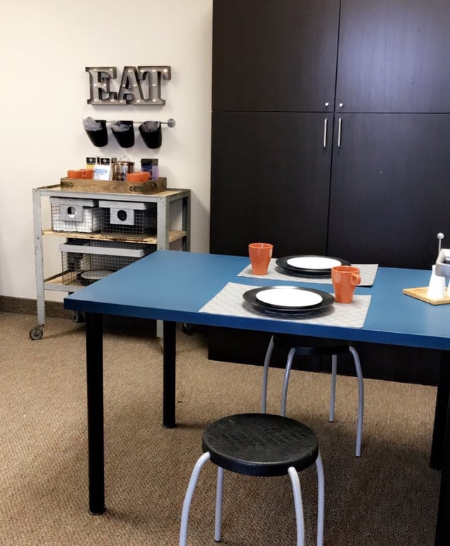 dining table with plates and cup