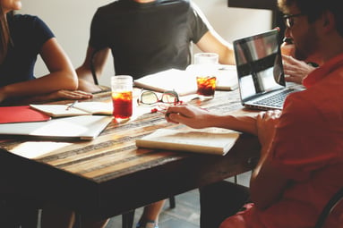 group of people discussing over a table