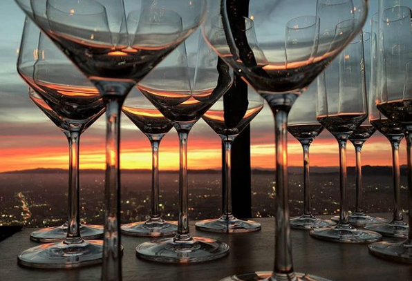A bunch of wine glass with sea background