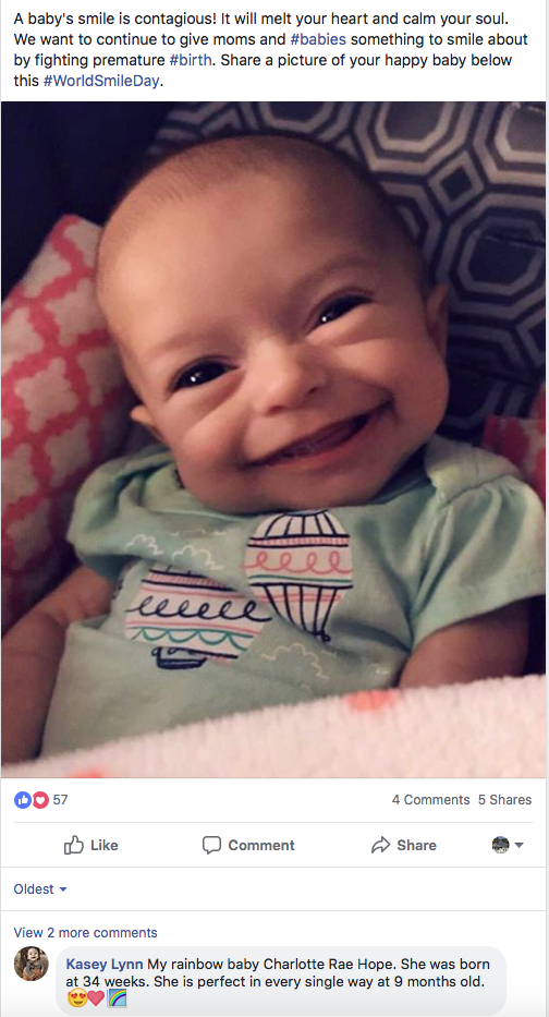A baby smiling on a Facebook post