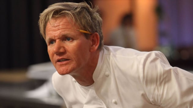 Gordon Ramsay with a pencil on his head in a chief suit
