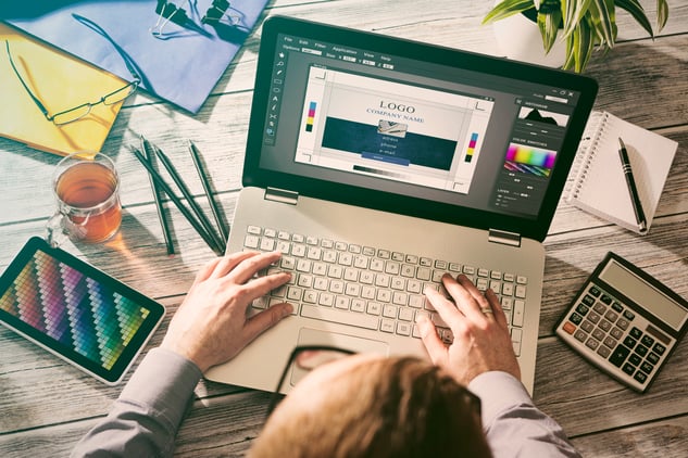 A woman designing a brand logo