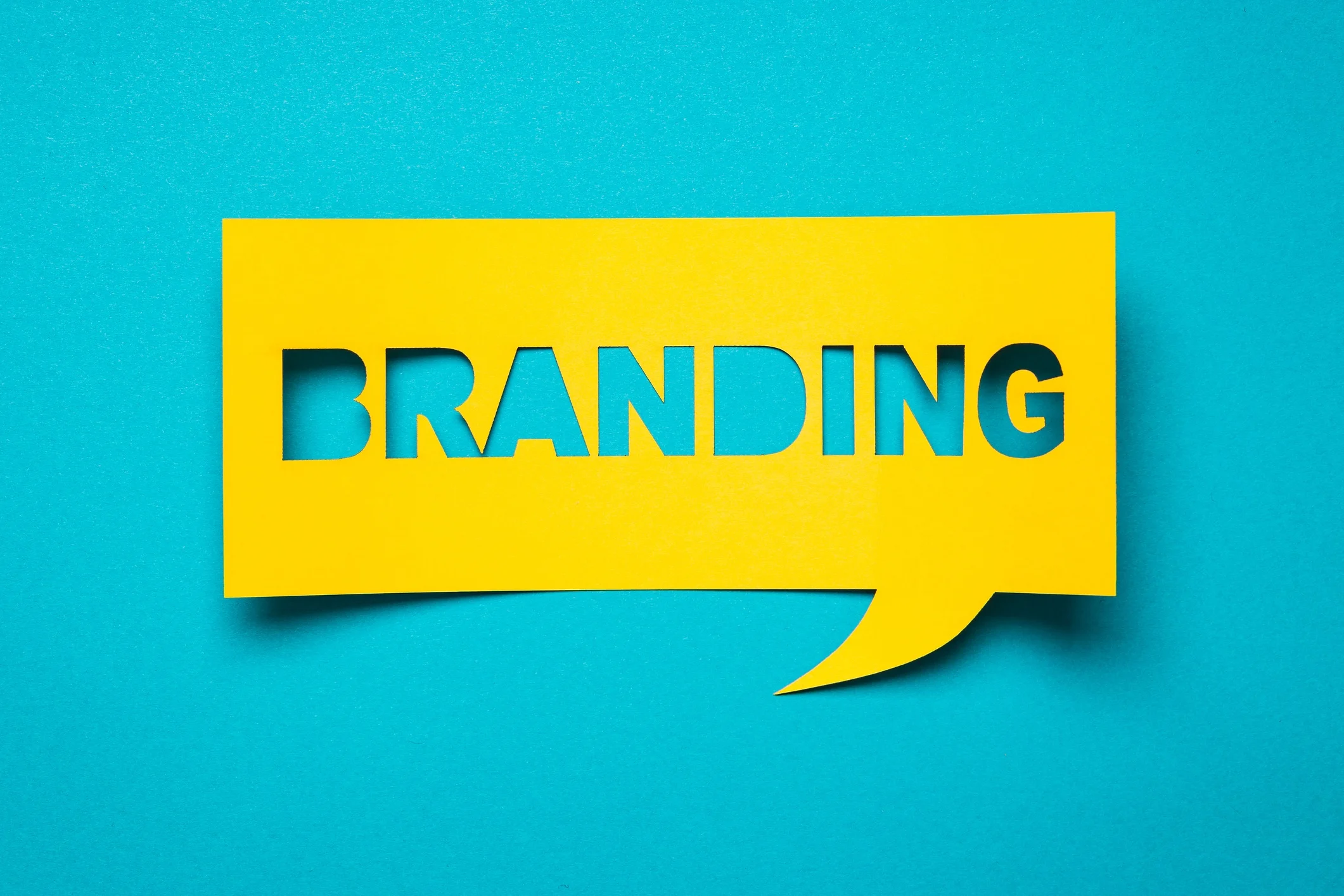 Branding note on a blue green background