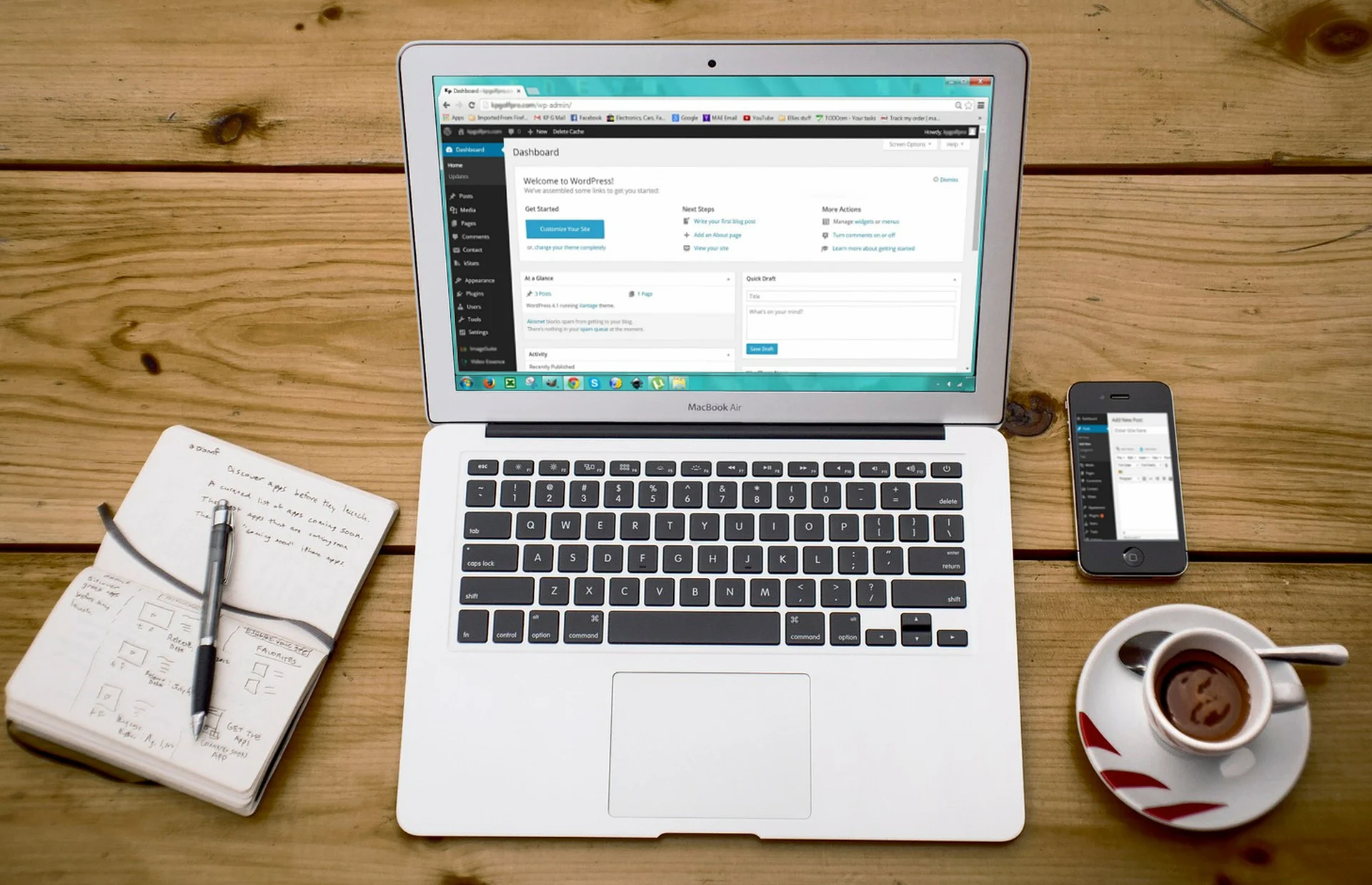 a pen notebook laptop and coffee